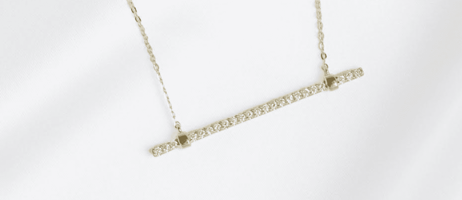 PaperCity and Diamonds Direct are partnering up to give away a a 14k yellow gold and diamond bar pendant that is valued at $1,500!